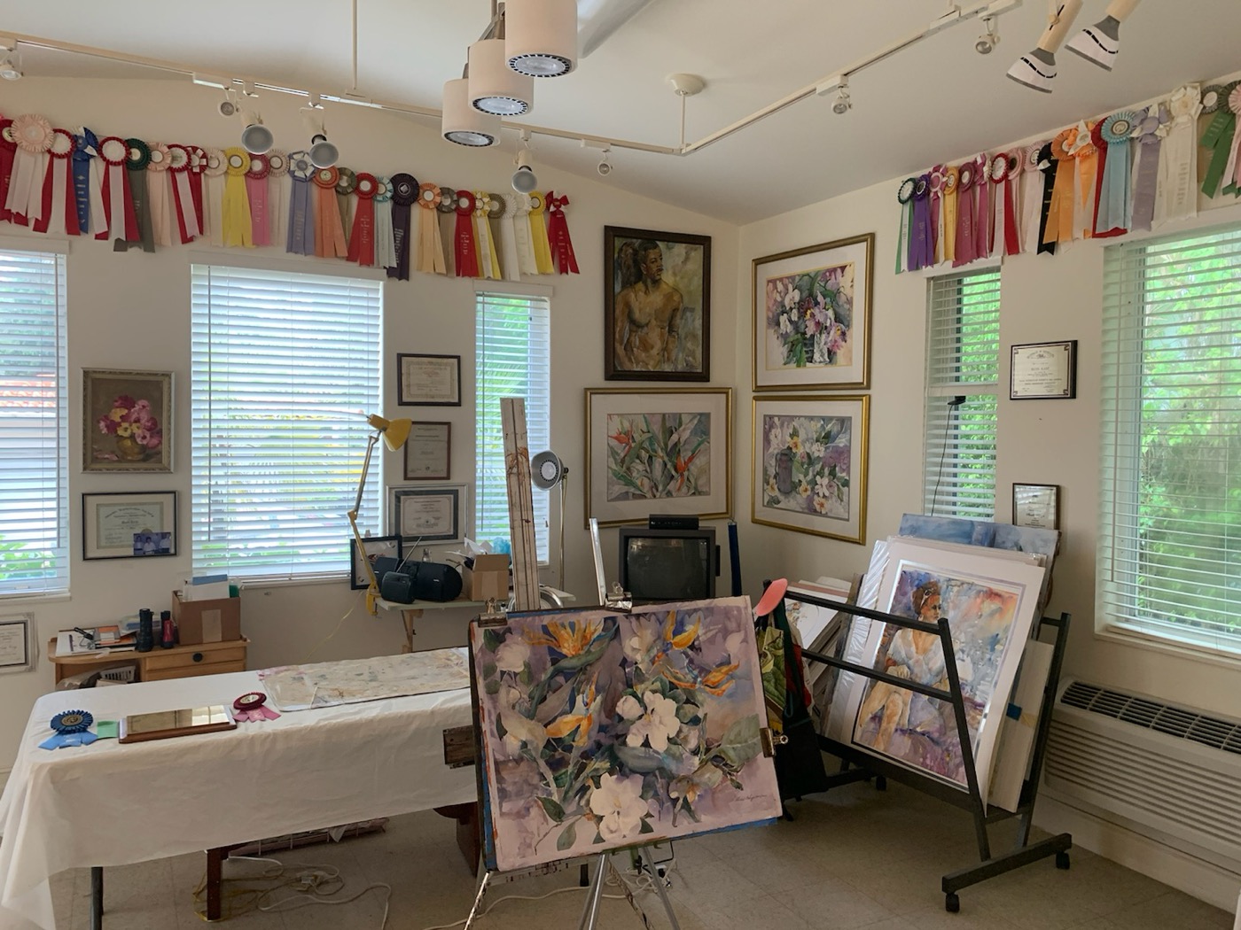 Ruth Karp's studio with award ribbons and paintings on display